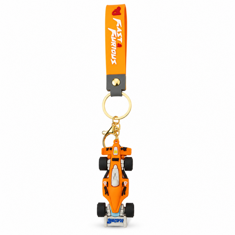 Orange Formula racing car PVC keychain with a detailed Formula-style race car, gold-tone keyring, lobster clasp, and orange silicone wrist strap featuring "Fast & Furious" text on a white background.