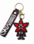 Stranger Things Demogorgon PVC keychain featuring a stylized Demogorgon character with a red flower-shaped head, matching Stranger Things silicone wrist strap, gold-tone keyring, and lobster clasp on a white background.